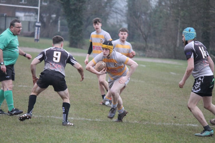 A Crediton Thirds player going for it with the ball during the game against South Molton Seconds.  AQ 0503
