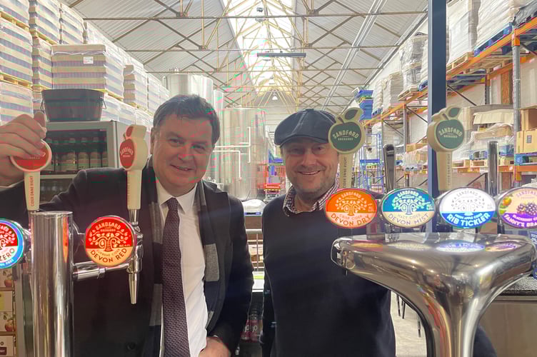 Mel Stride MP with renowned cider maker, Barney Butterfield, at Sandford Orchards in Crediton. 
