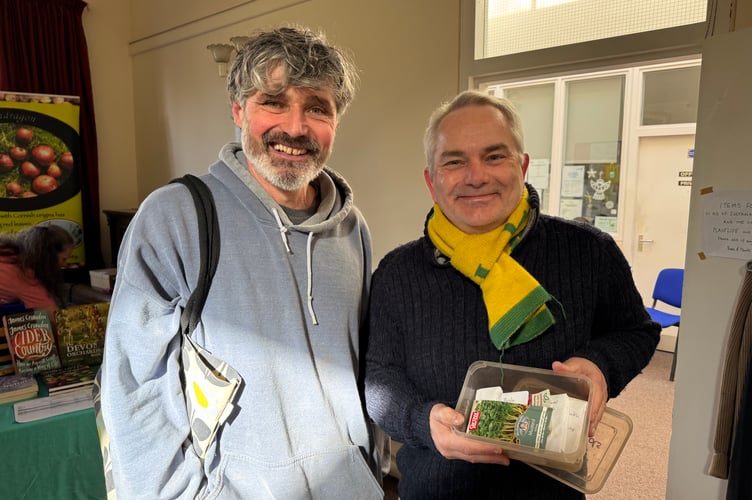Bringing seeds to share at Sustainable Crediton Seed Share.  AQ 4403

