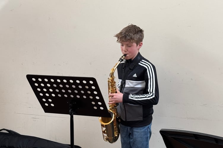 Otto Steer (12), a member of Crediton Youth Orchestra, performed at the Seed Share.  AQ 4422
