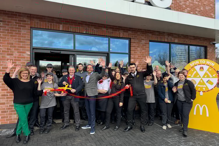 Before the Mayor of Crediton cuts the ribbon to open Crediton McDonald’s restaurant, with franchise owner David Shawyer and restaurant staff.  AQ 4900
