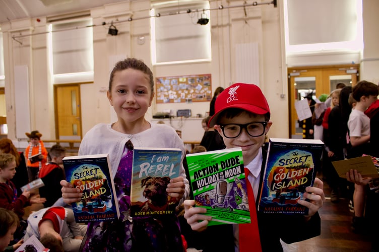 27 February 2025 Bookery World Book Day Haywards 6x pic special Pupils with their book choices (Will Goddard, Crediton Courier)