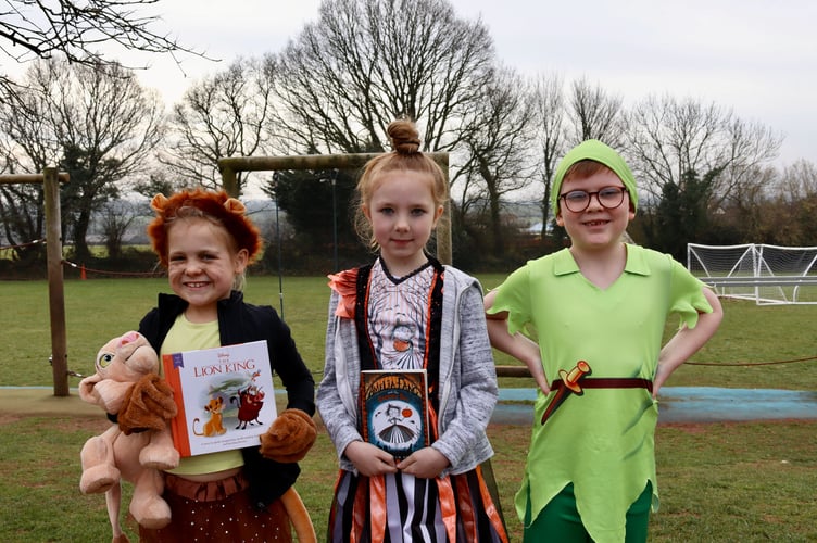 Pupils in costume with books