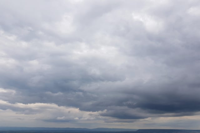 Mild day with partial clouds and light drizzle likely tomorrow
