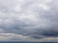 Mild day with partial clouds and light drizzle likely tomorrow