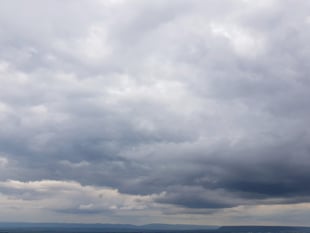 Overcast with a slight chance of rain turning sunny tomorrow