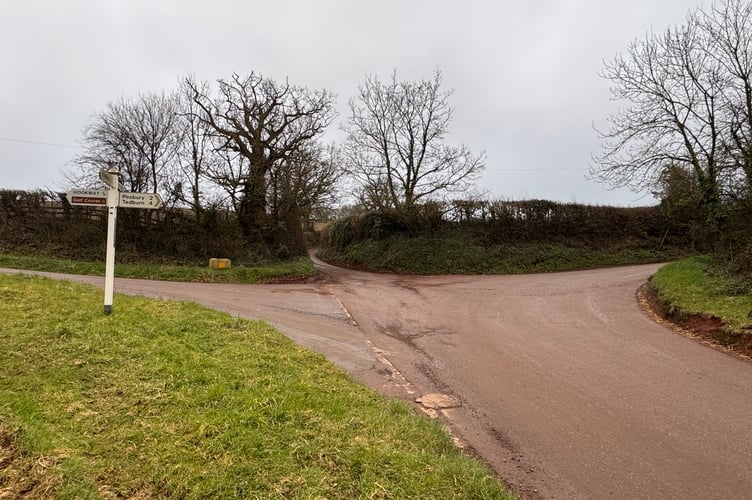 Fordton Cross where road markings are worn away and signage is misleading.  AQ 5512
