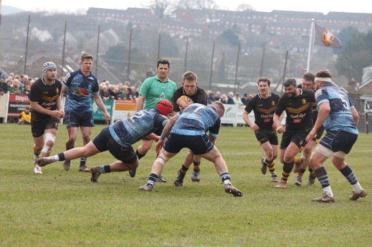 Two Tiverton players try to put a stop to a Crediton player.  AQ 0723

