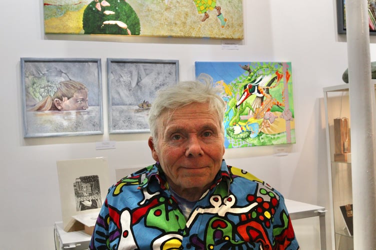 14 March 2025 Art Plus Frames exhibition 6x pic special John Hurford with some of his Alice in Wonderland-inspired paintings (Will Goddard, Crediton Courier)