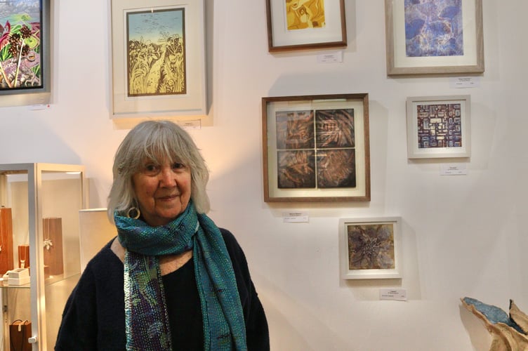 Pauline Pearce with a selection of her prints