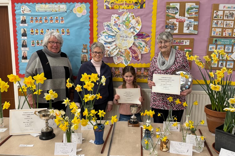 From left, Marie Finlinson and Jackie Kitchen, Tedburn St Mary Spring Show organisers with Children’s Cup winner Flora Parkinson and Cynthia Donald, who received the Best Exhibit in the Show.  AQ 5734
