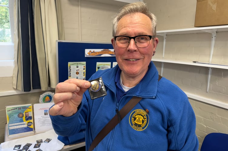 Charles Conibear sold Devon Association of Bellringers Centenary Gifts including badges and fleeces.  AQ 5652
