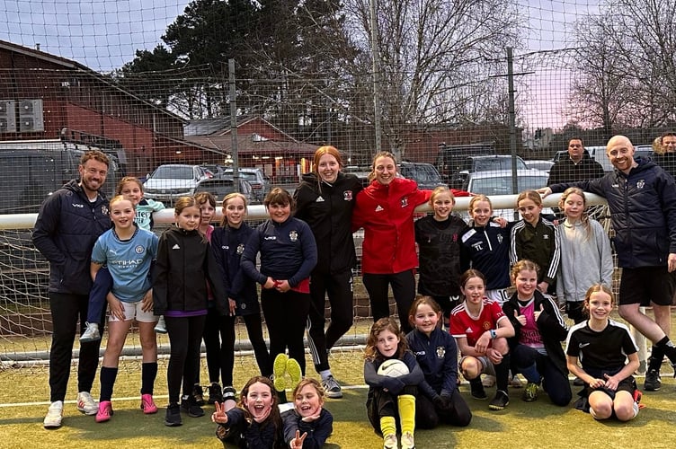 Crediton Youth Girls sides had two special guests recently at their Friday night training sessions.  Bow Jackson and Jess Sandland, centre, from Exeter City FC ladies team went along and actively got involved in many of the training sessions taking part that evening.
