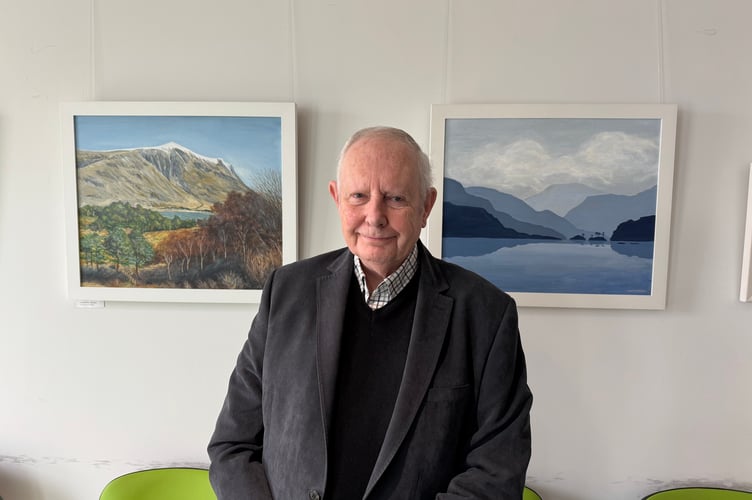 Justin Beament beside some of his work.  AQ 7162