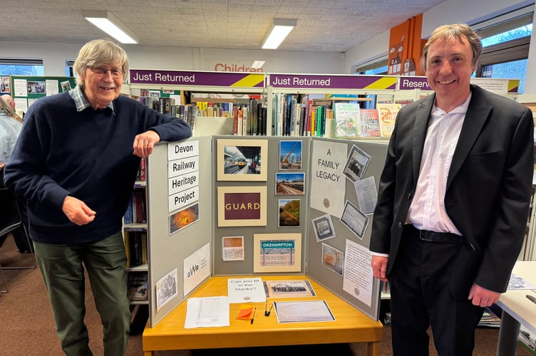 Dick Henrywood of Bow Station, left, and Tim Steer, North Devon Rail Line advocate, beside their displays.  AQ 7031
