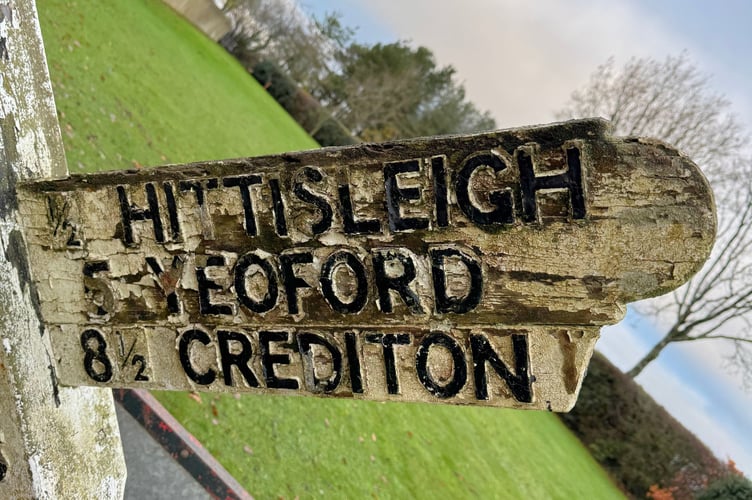 Previous Dennis Down Cross signpost in disrepair