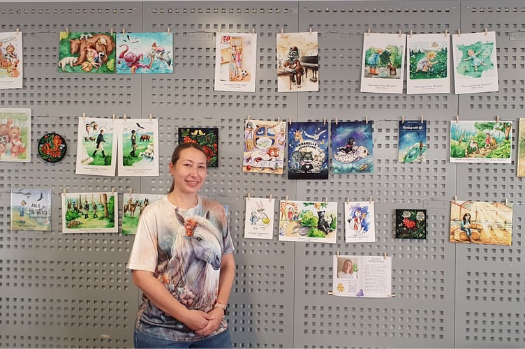 Kateryna Rohotova with her exhibited art