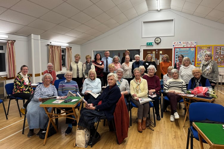 Alan Quick, editor of the Crediton Courier, photographed with members of Tedburn St Mary WI.  AQ 7782
