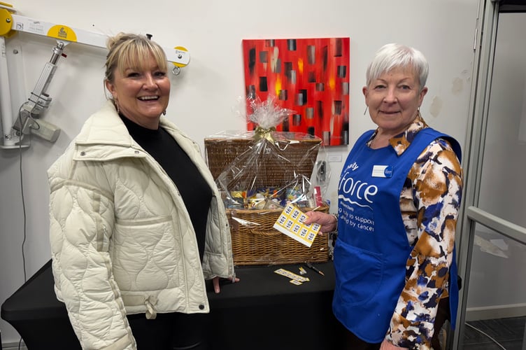 Sandra Carpenter, right, ran the Hamper Draw at Dolphin Stairlifts Bake Sale.  AQ 7892
