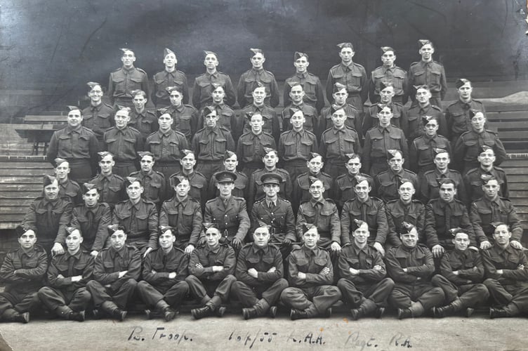 Charlie Haydon, seated fourth left, second row from the front, with his Army regiment.