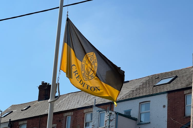 The Town Council flag flying at Half Mast in Crediton.  AQ 8388