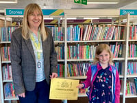Hannah reads 100 books in library challenge