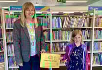 Hannah reads 100 books in library challenge