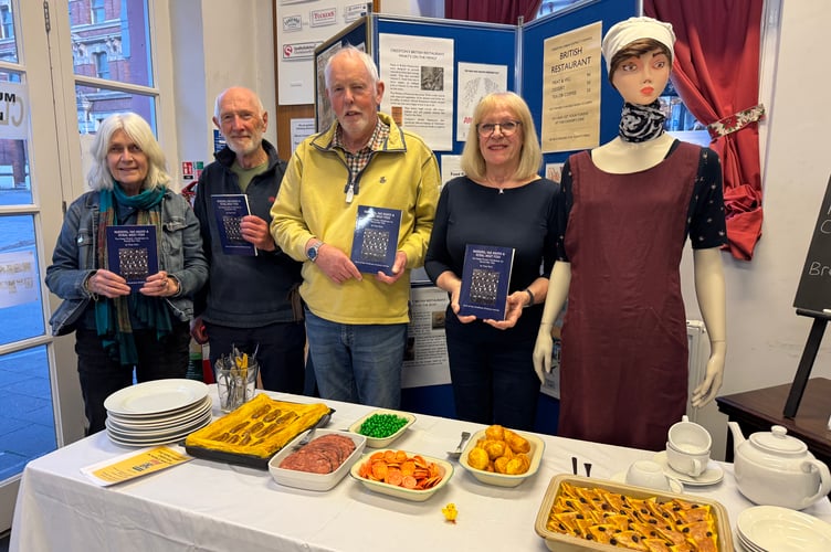 With copies of ‘Wardens, Gas Masks and Rural Meat Pies’, from left, Jo Poulton, Tony Gale, Richard Nunn and Cheryl Lewis beside one of the mannequins.  AQ 8349
