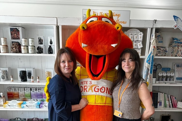 Alison Jordan and Teagan Shaw from Pete’s Dragons pose with their fund-raising Dragon Mascot.
