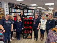 Devon Air Ambulance founder visits its Crediton charity shop
