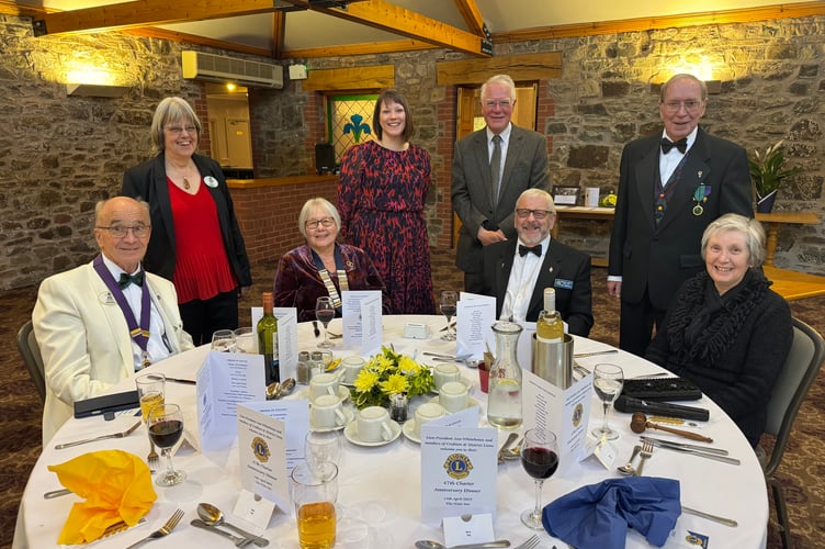 At the Lions Charter dinner, seated from left, District Governor Kevin Moore MJF, President Ann Whitehouse, Lion John Whitehouse MJF and Sue Parkes and standing, from left, Catherine Moore, Sophie Davies, Andrew Davey and Lion Eric Parkes MJF.  AQ 8598
