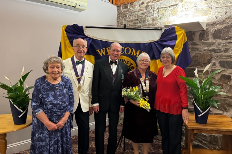 Ladies who received flowers at the Lions Club of Crediton and District 47th Charter Anniversary celebration, Wendy Quick, left, and right, Catherine Moore with second right, President Ann Whitehouse, District Governor Kevin Moore MJF and Lion Eric Parkes MJF.  AQ 8625
