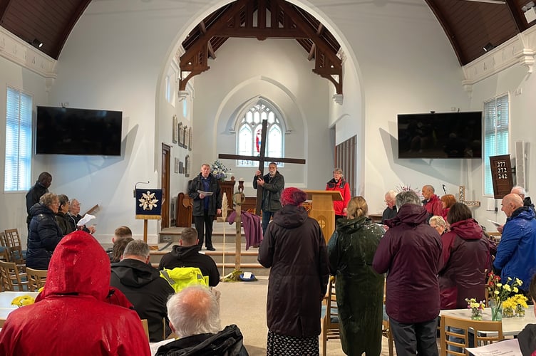 Singing a hymn at Crediton Methodist Church
