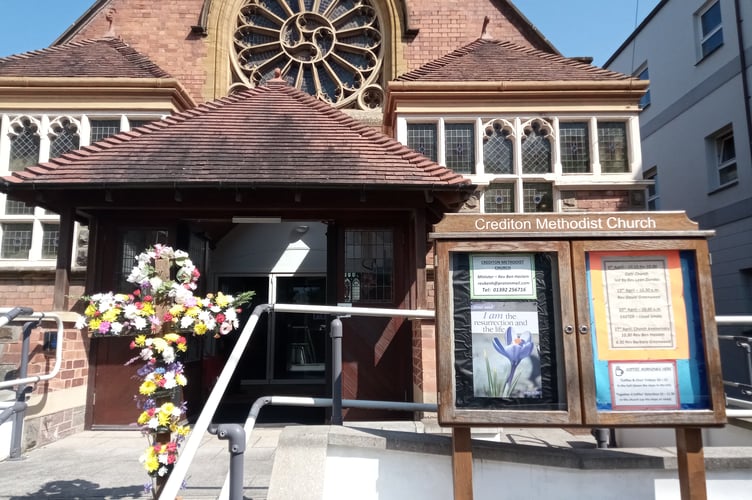 The decorated cross placed outside Crediton Congregational Church.
