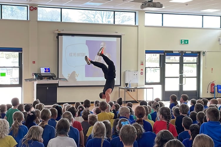 Mr George doing a walking handstand
