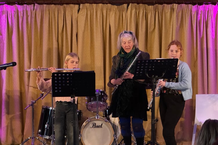 Young flautists with their tutor during their performance.  AQ 7232
