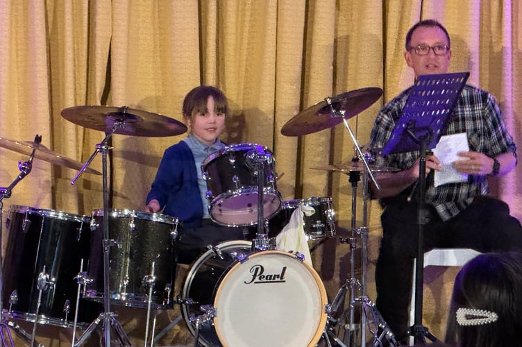 A young drummer and her tutor Tom White.  AQ 7276
