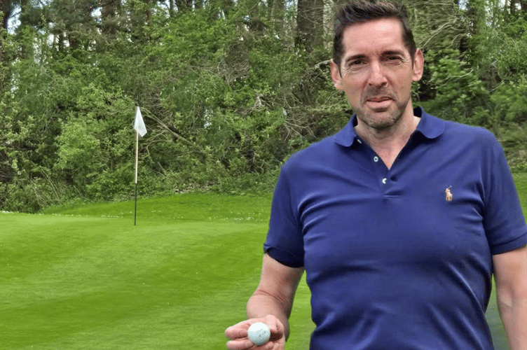 Paul Luxton celebrating his hole-in-one on the 11th green