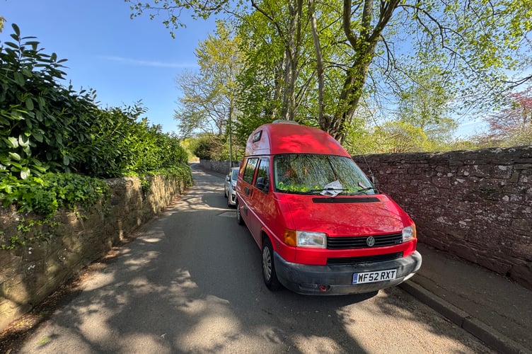 The red VW camper and grey coloured Kia are causing traffic issues.  AQ 9705
