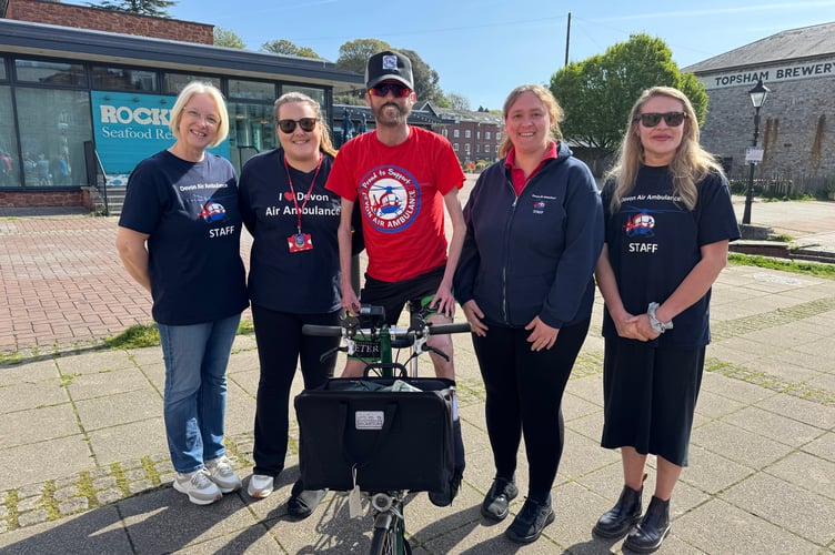 Tom Staniford with Devon Air Ambulance representatives before his charity cycle ride, which has raised £13,700 to-date.  AQ 9465
