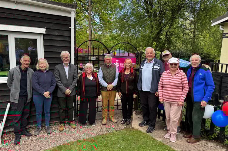 Jerry Brook, centre left, before opening the Community Garden at Pathfinder Village Hall. AQ 0501
