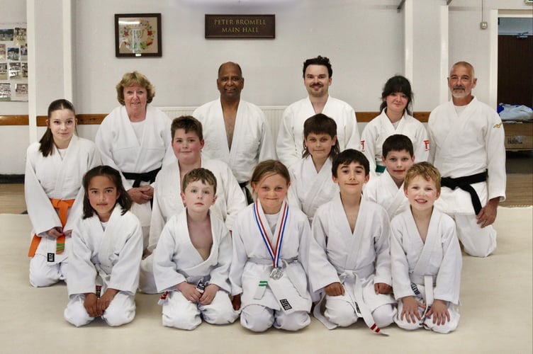 Harriet with her silver medal, front, with members of Tedburn St Mary Judo Club