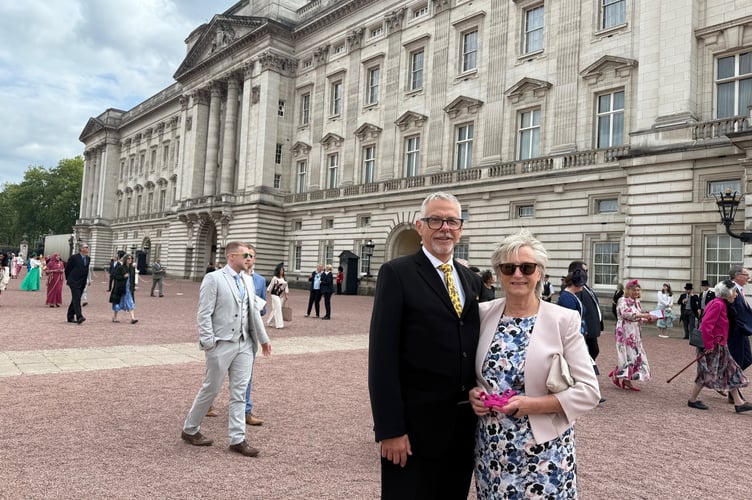 Cllr John Downes and his wife, Christine making their way in to a garden party at Buckingham Palace.