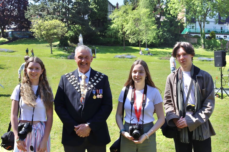 Mayor of Crediton Guy Cochran with QE A-level photography students Olivia Harris, Emily Scoins and James Barton