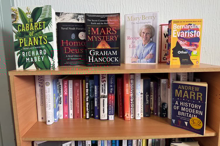 Books on shelves at Morchard Bishop Book Swap. AQ 7831