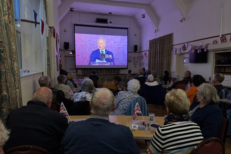 Watching the King’s speech on the big screen at Coldridge on the 80th anniversary of VE Day.  AQ 0892
