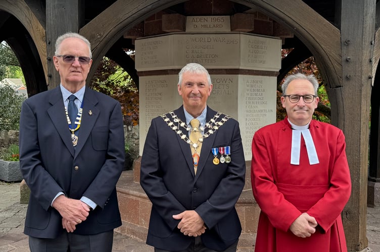 At the flag raising ceremony, from left, Mike May from Crediton RBL, the Mayor of Crediton Cllr Guy Cochran and Rev Matthew Tregenza.  AQ 0791
