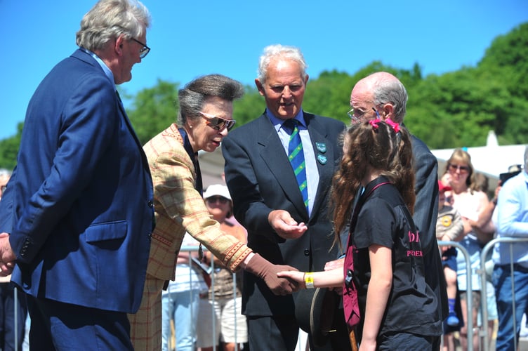 Devon County Show. Show President HRH The Princess Royal meets young handler Nancy Budge
