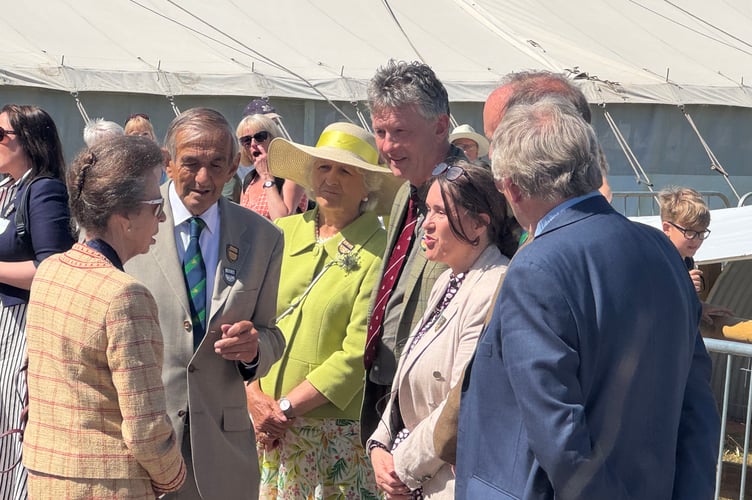 Show Manager Lisa Moore, right, talking to the Princess Royal as she arrives at the Show, with also right, Crediton farmer Andy Gray, Show Chairman of Council and Chairman of the Board of Trustees with other Show guests and officers. AQ 1867