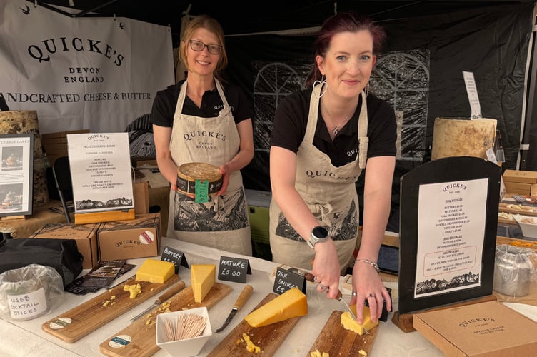 Sarah and Megan from Quickes Traditional of Newton St Cyres, offered cheese samples to Show visitors in the Food and Drink marquee. AQ 1736